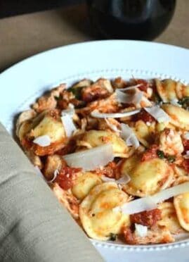Chicken Bruschetta Ravioli is comfort food done right! This 5 ingredient dinner is on the table in 20 minutes or less and will please any picky eater.