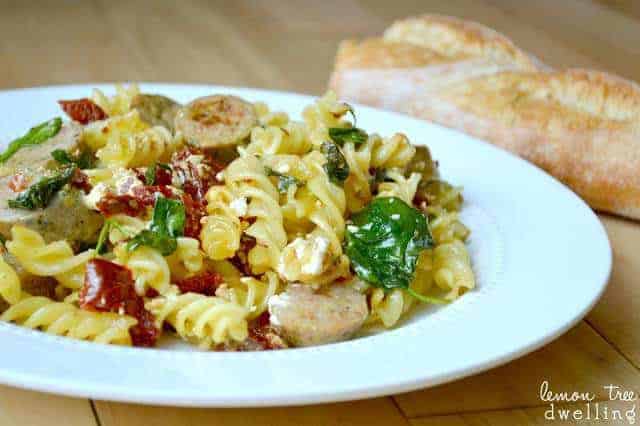 white dinner plate with sundried tomato pasta