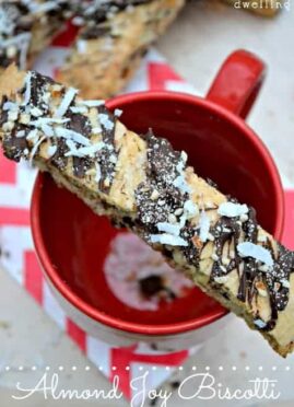 Almond Joy Biscotti is sinfully delicious! This rich biscotti is stuffed with chocolate, coconut, and almonds and drizzled with more of the same!