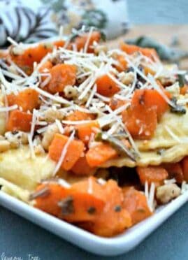 Butternut Squash Ravioli is simply delectable as a main dish or side dish. Cheese ravioli is topped with delicious butternut squash, fresh sage and walnuts. This is perfect for those cold winter nights!