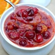 Orange Spiced Cranberry Sauce is not your basic cranberry sauce! These tart cranberries and the sweetness of oranges are mixed with flavorful spices for a Thanksgiving side dish that will please a crowd!