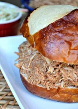 Slow Cooker Shredded Chicken is moist and juicy that it literally shreds itself! This game day sandwich is a must in your house! It is the best shredded chicken I've ever tasted....no barbecue sauce needed!!