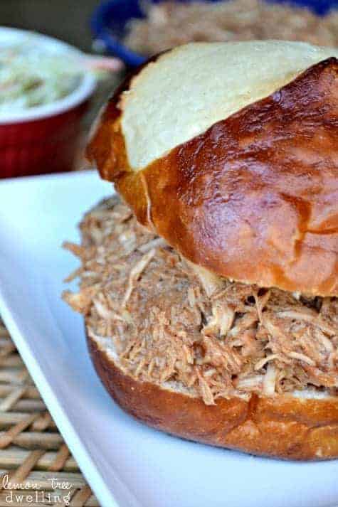 Slow Cooker Shredded Chicken is moist and juicy that it literally shreds itself! This game day sandwich is a must in your house! It is the best shredded chicken I've ever tasted....no barbecue sauce needed!!