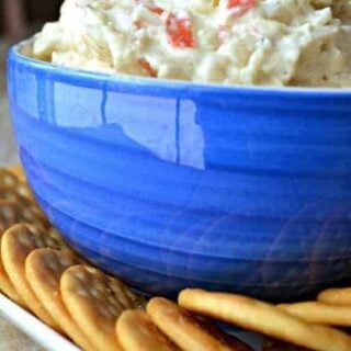 Crock Pot Crab Dip is a deliciously creamy dip made with 2 different kinds of cheese, imitation crab, and a splash of white wine. It's simple, it's delicious, and best of all.....it's made in a crock pot!