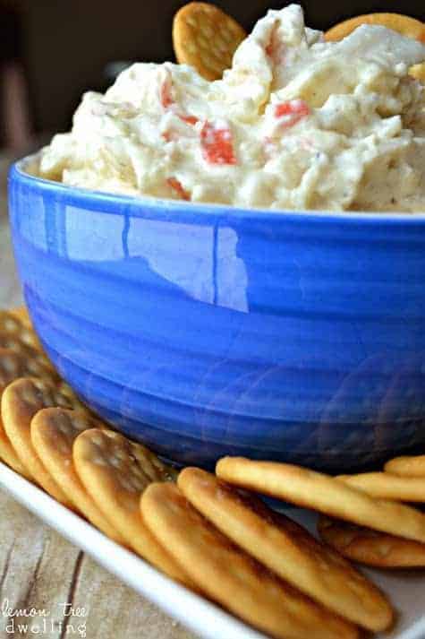 Crock Pot Crab Dip is a deliciously creamy dip made with 2 different kinds of cheese, imitation crab, and a splash of white wine. It's simple, it's delicious, and best of all.....it's made in a crock pot!