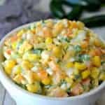 Jalapeno Corn Dip is loaded with fresh peppers, onions, cilantro, and cheese for a spicy Mexican dip