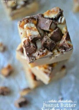 White Chocolate Peanut Butter Snickers Fudge will be the hit of your holiday party! These creamy fudge morsels take 5 minutes or less to make, and 2 seconds to eat! Simply delicious and a perfect sweet treat.