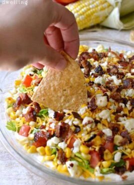  Cobb Dip is a delicious light dip made with creamy ranch, lettuce, tomatoes, grilled corn, shredded cheese, bacon, and blue cheese crumbles. The perfect party dip recipe!