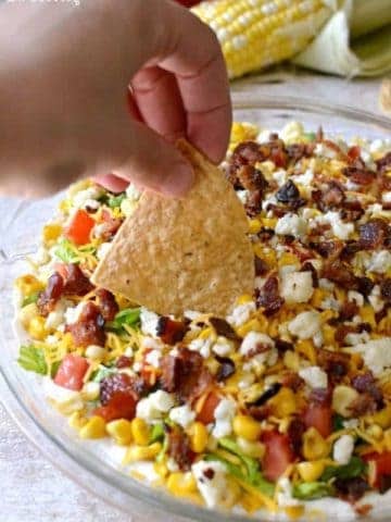  Cobb Dip is a delicious light dip made with creamy ranch, lettuce, tomatoes, grilled corn, shredded cheese, bacon, and blue cheese crumbles. The perfect party dip recipe!