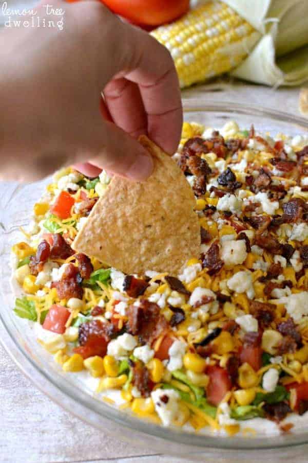  Cobb Dip is a delicious light dip made with creamy ranch, lettuce, tomatoes, grilled corn, shredded cheese, bacon, and blue cheese crumbles. The perfect party dip recipe!