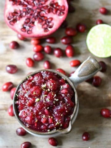 Gingered Pomegranate Lime Cranberry Sauce is a delicious twist on tradition. This ridiculously easy cranberry sauce is a gorgeous addition to your meal and perfect for the holidays!