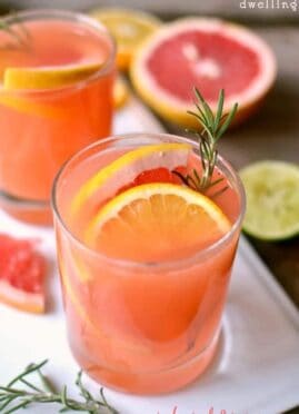 Ruby Red Rosemary Cocktail is a refreshing drink that makes a surprising addition to your fall table. Ruby red grapefruit juice with a splash of lemon and lime and a sweet rosemary simple syrup