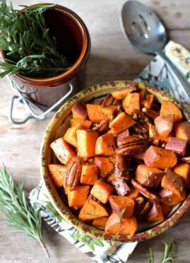 Rosemary Roasted Sweet Potatoes, simply prepared with olive oil, sea salt, fresh cracked pepper, and a touch of maple syrup, tossed with toasted pecans for extra crunch! This simply elegant side dish is perfect for any table