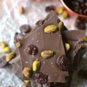 Salted Chocolate Cherry Pistachio Bark is a super easy chocolate bark that's topped with dried cherries, roasted pistachios, and a touch of sea salt. This 5-minute dessert is perfect for holiday gifting!