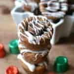 Molasses Rolo Cookie Cups are packed full of holiday flavors! Rolled in sugar, stuffed with Rolos, and drizzled with white chocolate, these cookie cups are a deliciously unexpected combination!