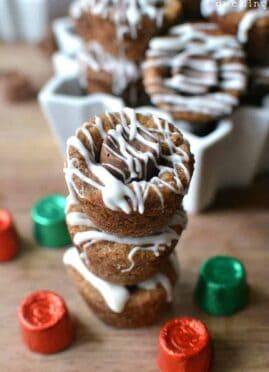 Molasses Rolo Cookie Cups are packed full of holiday flavors! Rolled in sugar, stuffed with Rolos, and drizzled with white chocolate, these cookie cups are a deliciously unexpected combination!