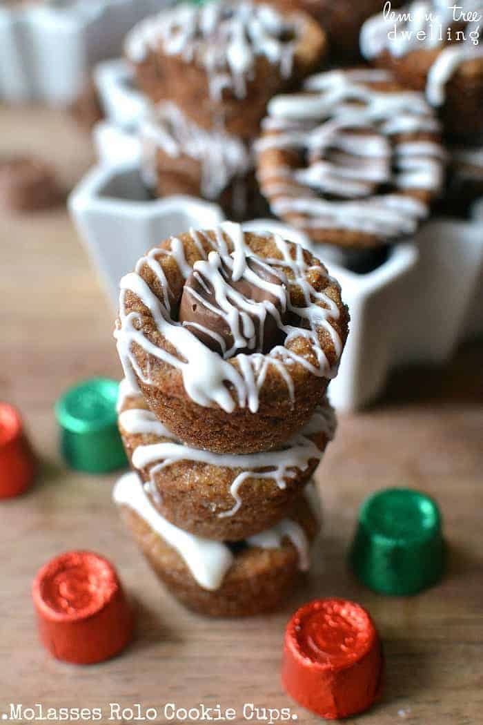 Molasses Rolo Cookie Cups are packed full of holiday flavors! Rolled in sugar, stuffed with Rolos, and drizzled with white chocolate, these cookie cups are a deliciously unexpected combination!