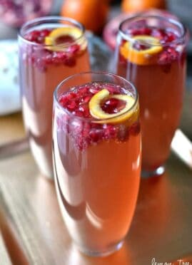 Pomegranate Orange Fizz Cocktail combines the classic flavors of pomegranate and orange with the celebratory feel of champagne. This festive drink is sure to be a crowd favorite.