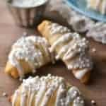 White Chocolate Almond Crescent Rolls will please any crowd and are so simple to make. These easy rolls are not only delicious, they're so pretty, too! Perfect for New Year's morning, a wedding shower, or any special occasion.