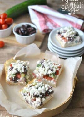 Greek Veggie Pizza Squares with crescent roll crust, tzatziki cream cheese, fresh Greek vegetables, and crumbled feta cheese!