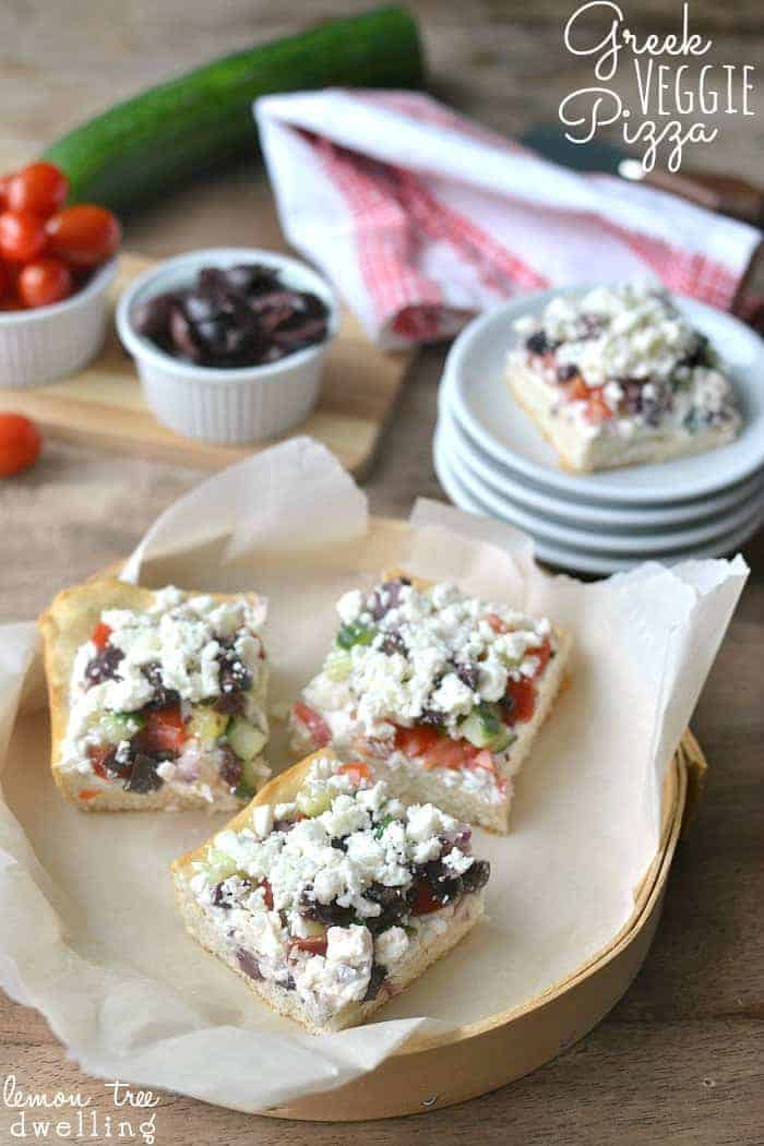 Greek Veggie Pizza Squares with crescent roll crust, tzatziki cream cheese, fresh Greek vegetables, and crumbled feta cheese!