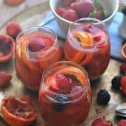 This Blood Orange Sangria is made with white wine, rum, and triple sec and garnished with fresh berries