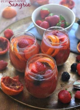 This Blood Orange Sangria is made with white wine, rum, and triple sec and garnished with fresh berries