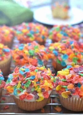 These Fruity Pebbles Muffins are the perfect St. Patrick's Day treat! These breakfast muffins are topped with white chocolate and Fruity Pebbles.