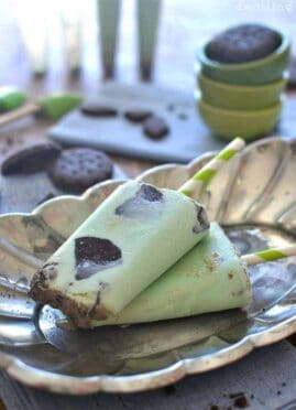 Creamy, delicious Thin Mint Ice Cream Popsicles are made with fresh cream and Thin Mint Girl Scout cookies!