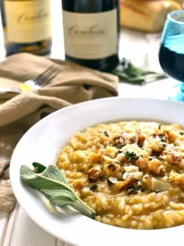 Butternut Squash Risotto is rich and creamy, flavored with allspice, walnuts, Parmesan, and chardonnay. It's the perfect fall risotto recipe, and a delicious addition to any holiday table!