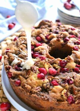 Cranberry-Pecan Coffee Cake is packed with fresh cranberries, pecans, and brown sugar streusel, then topped with a creamy vanilla glaze. Make this coffee cake recipe for breakfast or dessert