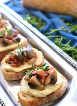 Mushroom Bacon Swiss Crostini is packed with delicious flavor and so simple to make! The perfect holiday appetizer recipe