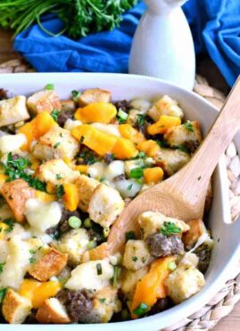 Poutine Stuffing is packed full of pork sausage and cheese curds and topped with a delicious poutine gravy. It's such a fun twist on classic poutine - the perfect Thanksgiving side dish recipe!