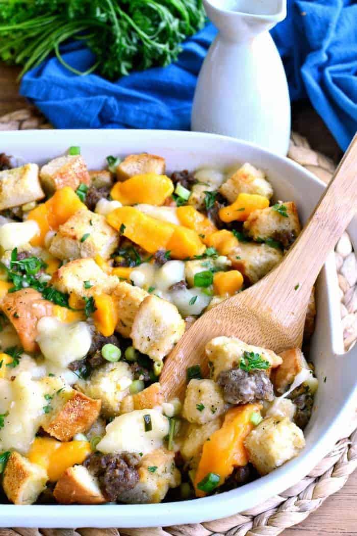 Poutine Stuffing is packed full of pork sausage and cheese curds and topped with a delicious poutine gravy. It's such a fun twist on classic poutine - the perfect Thanksgiving side dish recipe!