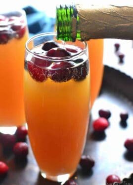 Cranberry Orange Mimosas are a deliciously sweet brunch cocktail and perfect for any celebration! This easy drink can be a beautiful accompaniment to any holiday table