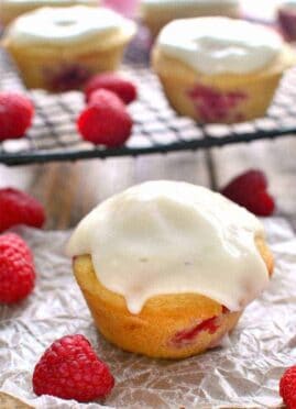 These Iced Raspberry Muffins are loaded with fresh raspberries and topped with a deliciously sweet cream cheese icing.