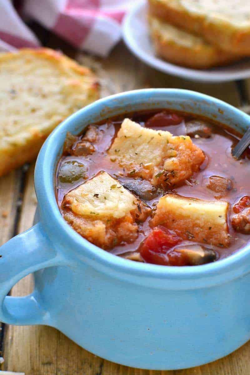 Italian Sausage Pizza Soup has all the flavors of pizza in a hearty, delicious, comforting bowl of soup! Plus 11 other delicious soup recipes for National Homemade Soup Day!