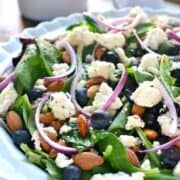 Blueberry Feta Salad is your new go-to salad recipe for spring! It combines fresh blueberries with feta cheese, almonds, and a lemon poppy seed vinaigrette dressing.