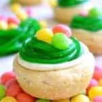 These Easter Egg Cookie Cups are easy, adorable, and so delicious! These quick and easy sugar cookies are topped with lemon buttercream, and Easter candy.