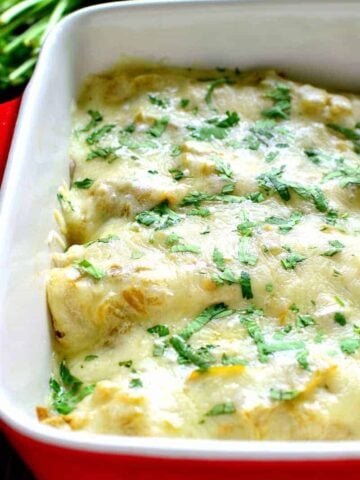 These Roasted Vegetable Enchiladas are packed with veggies and beans then topped with a creamy chile verde sauce and melted cheese. A perfect meatless meal