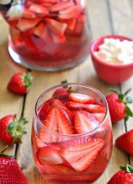 overhead image of a glass filled with strawberry shortcake sangria