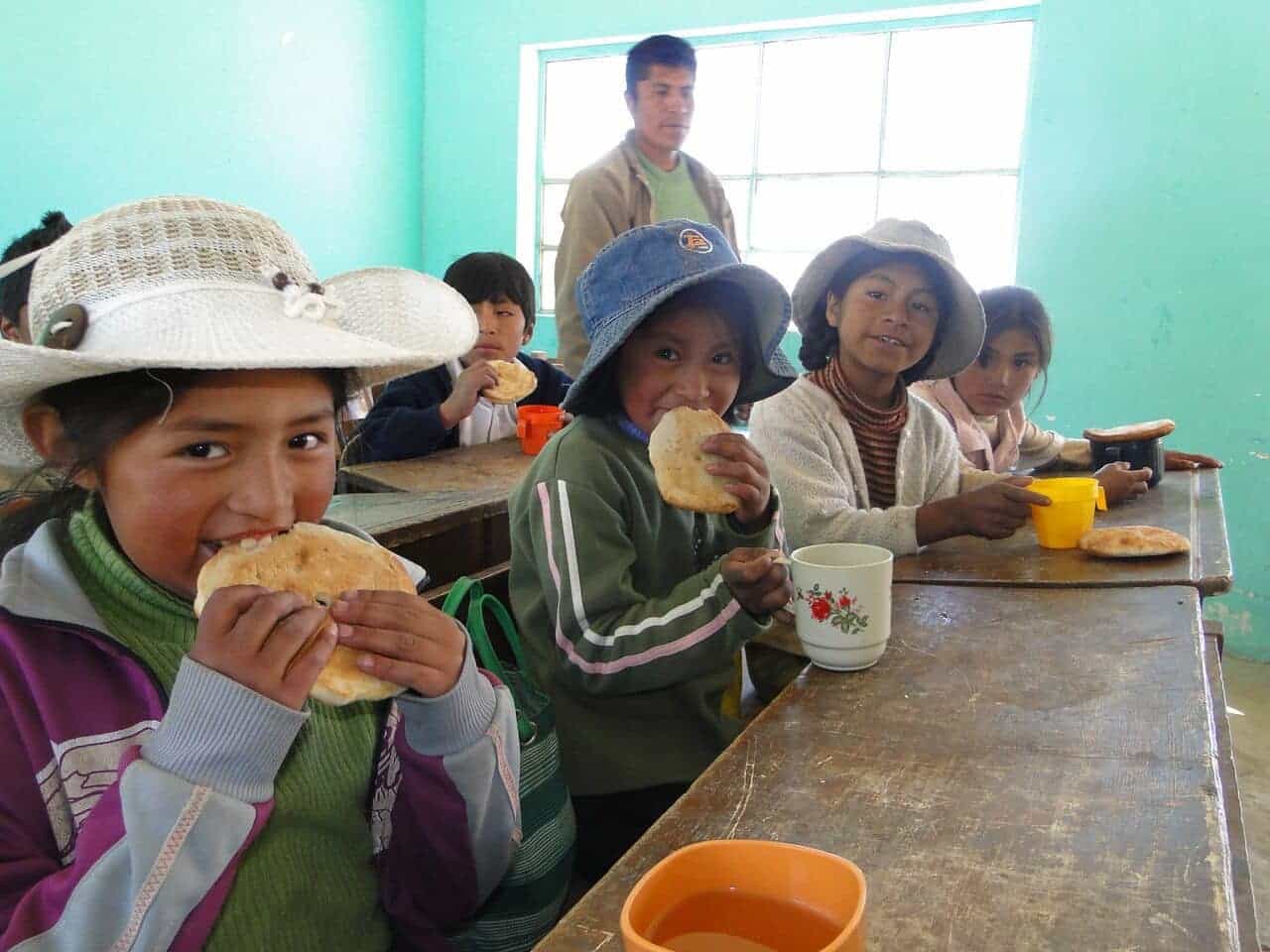 Bolivian school children eating their lunch
