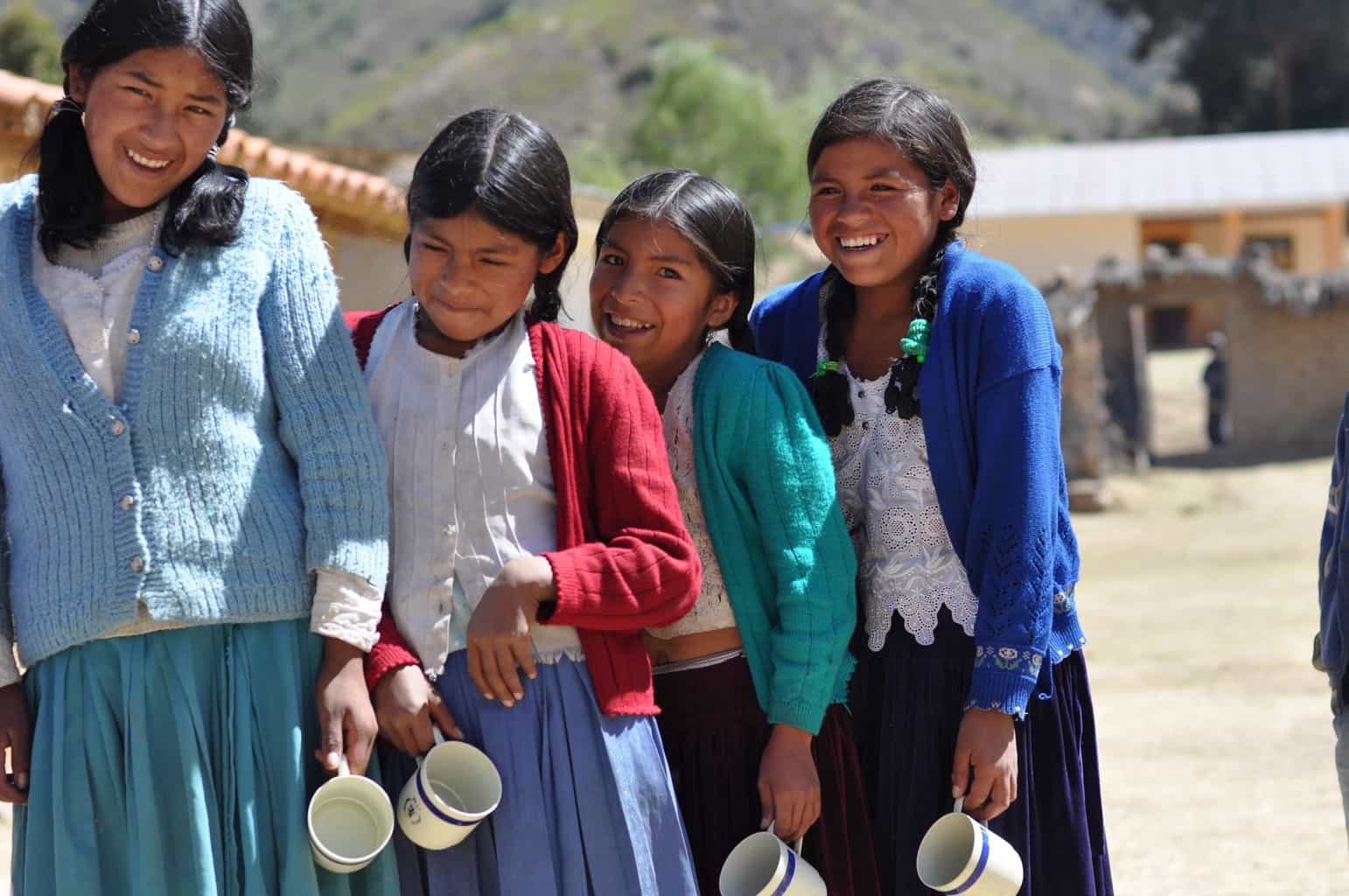 4 young smiling Bolivian girls