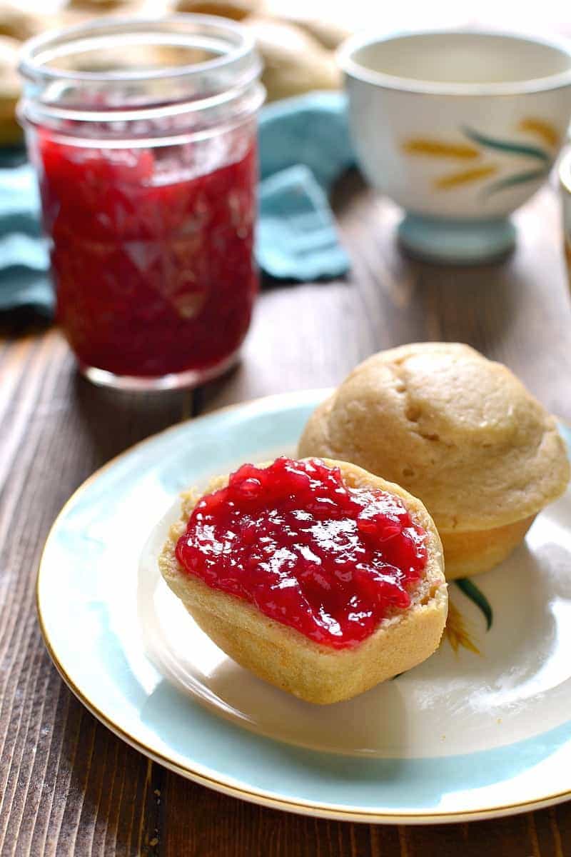 half of a vanilla muffin topped with homemade strawberry jam