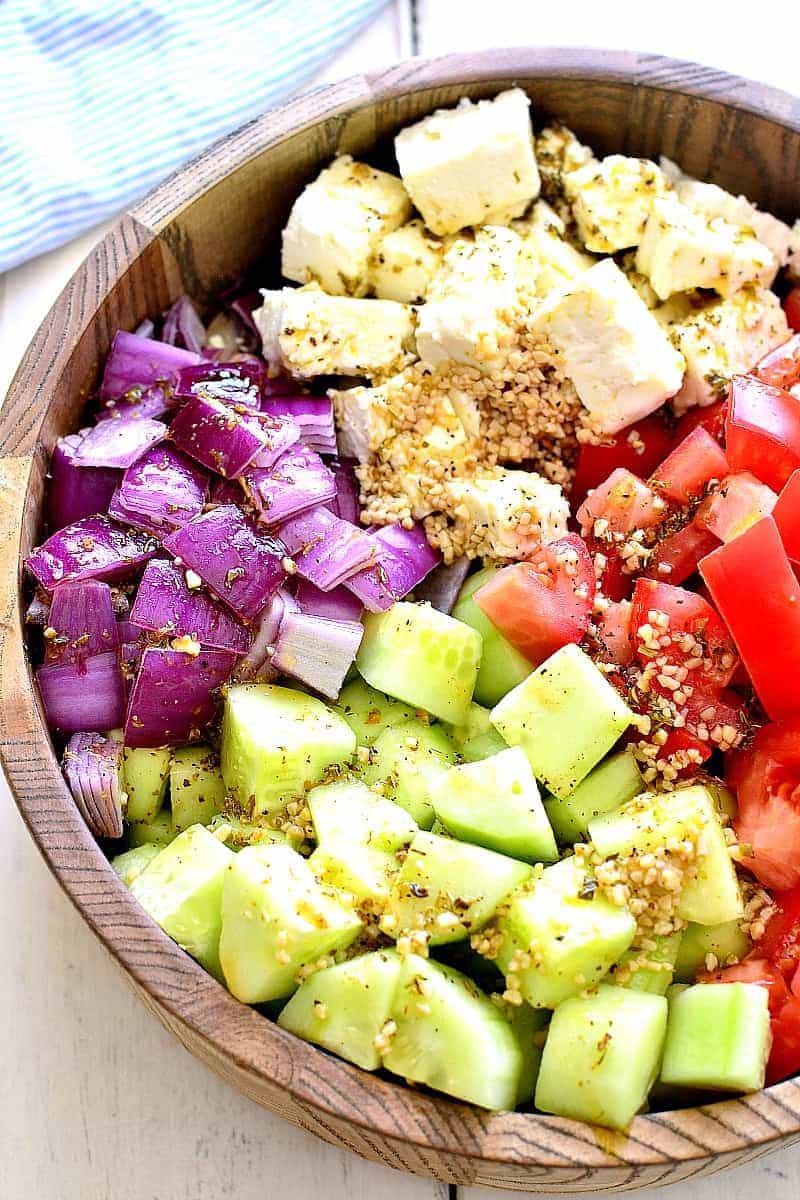 This Tomato, Cucumber & Feta Salad is fresh, flavorful, and SO delicious! It comes together quickly with just a handful of ingredients and is one of our favorite go-to salads for summer!