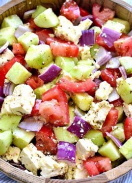 Tomato Cucumber Feta Salad is fresh, flavorful, and SO delicious! This easy summer salad recipe comes together quickly. with just a handful of ingredients.