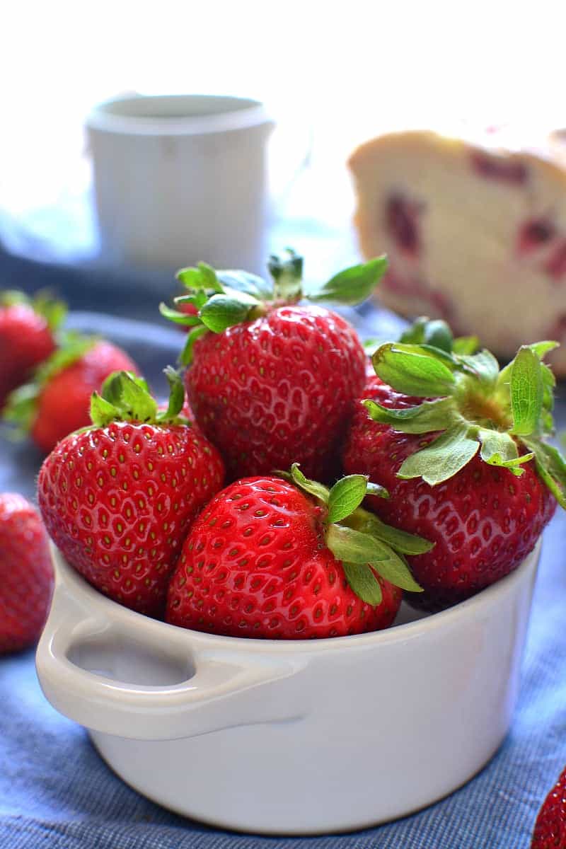 Fresh strawberries in a white bowl