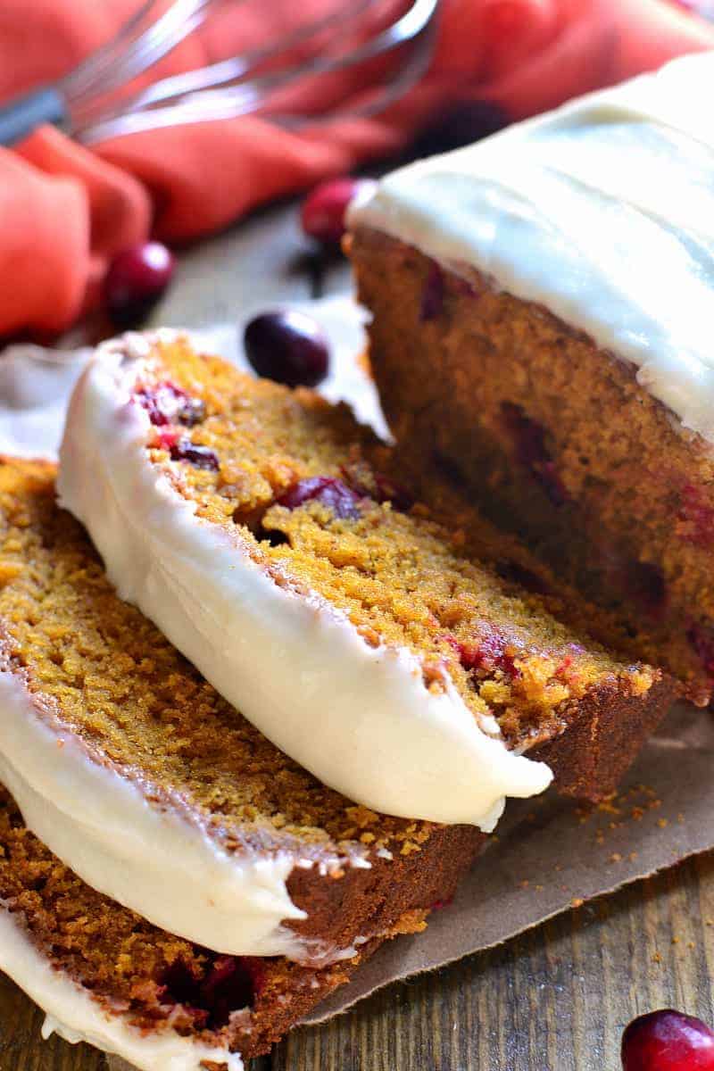 Cranberry pumpkin bread is the BEST pumpkin bread recipe, made better with the addition of fresh cranberries and sweet cream cheese icing! The perfect dessert or brunch recipe for your holiday table!