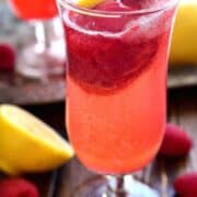Lemon Raspberry Champagne Float will be the perfect drink to ring in the New Year! It's simple, festive, and oh so delicious - the ideal drink for any celebration!