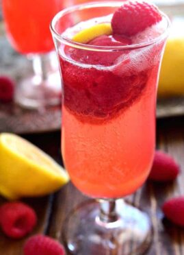 Lemon Raspberry Champagne Float will be the perfect drink to ring in the New Year! It's simple, festive, and oh so delicious - the ideal drink for any celebration!